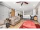 Open-concept living space with hardwood floors and a rustic barn door accent at 2062 S Emerson --, Mesa, AZ 85210