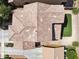 Aerial view of a home featuring a well-maintained roof, backyard turf, and modern concrete driveway at 2096 S Moccasin Trl, Gilbert, AZ 85295
