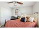 Comfortable bedroom featuring a ceiling fan, natural light, and stylish furnishings for a relaxing retreat at 2096 S Moccasin Trl, Gilbert, AZ 85295