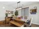 Bright dining room with wood table, chandelier, and stylish decor at 2096 S Moccasin Trl, Gilbert, AZ 85295