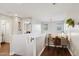 Second floor landing with desk, chair, and two bright windows at 2096 S Moccasin Trl, Gilbert, AZ 85295