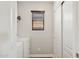 Functional laundry room with white appliances, a storage closet, and a window offering natural light at 2096 S Moccasin Trl, Gilbert, AZ 85295