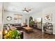 Comfortable living room with fireplace, hardwood floors, and large leather sectional at 2096 S Moccasin Trl, Gilbert, AZ 85295