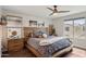Serene main bedroom with wood accents, ceiling fan, and a cozy, inviting aesthetic at 2096 S Moccasin Trl, Gilbert, AZ 85295