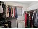 Walk-in closet with ample storage space, organized racks, and natural light from a window at 2096 S Moccasin Trl, Gilbert, AZ 85295