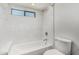 Bathroom featuring subway tile bathtub and modern fixtures at 225 W Winged Foot Rd, Phoenix, AZ 85023