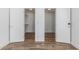 Spacious walk-in closet with modern white doors and custom shelving for optimal storage and organization at 225 W Winged Foot Rd, Phoenix, AZ 85023