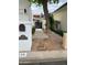 Landscaped entry to home with mailbox, address, and modern horizontal slat privacy screen at 225 W Winged Foot Rd, Phoenix, AZ 85023
