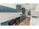 Modern kitchen boasts stainless steel appliances, sleek cabinetry and quartz countertops at 225 W Winged Foot Rd, Phoenix, AZ 85023
