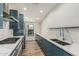 Stylish modern kitchen with quartz countertops, stainless steel appliances and sleek cabinets at 225 W Winged Foot Rd, Phoenix, AZ 85023