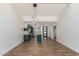 Bright, open living space with modern lighting and a view of the kitchen's sleek cabinetry at 225 W Winged Foot Rd, Phoenix, AZ 85023