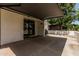 Covered patio featuring sliding glass doors and exterior lighting, perfect for outdoor enjoyment at 225 W Winged Foot Rd, Phoenix, AZ 85023