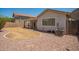 Well-kept backyard with a covered patio and rocks at 25732 W Elizabeth Ave, Buckeye, AZ 85326