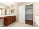 Bathroom features a spacious vanity with dual sinks and a walk-in closet at 25732 W Elizabeth Ave, Buckeye, AZ 85326