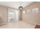 Dining room features tile floor, modern lighting, and sliding glass door access to backyard at 25732 W Elizabeth Ave, Buckeye, AZ 85326