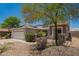 Charming single-story home featuring a stone facade and desert landscaping at 25732 W Elizabeth Ave, Buckeye, AZ 85326