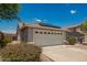 Single-story home with a two-car garage and low-maintenance desert landscaping at 25732 W Elizabeth Ave, Buckeye, AZ 85326