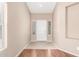 Bright entryway featuring tile flooring, neutral walls, and a modern front door at 25732 W Elizabeth Ave, Buckeye, AZ 85326