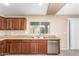 Close up view of well-equipped kitchen boasting stainless steel appliances and granite countertops at 25732 W Elizabeth Ave, Buckeye, AZ 85326