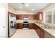 Well-equipped kitchen boasts stainless steel appliances and granite countertops, perfect for cooking at 25732 W Elizabeth Ave, Buckeye, AZ 85326