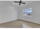 Bright bedroom with tile floors, a ceiling fan, and a window for natural light and comfortable living at 28834 N 175Th Ave, Surprise, AZ 85387