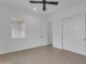 This bedroom offers a neutral color scheme and tile floors for personalization and comfortable living at 28834 N 175Th Ave, Surprise, AZ 85387