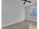 This cozy bedroom features tile floors, a ceiling fan, and a window for natural light and comfortable living at 28834 N 175Th Ave, Surprise, AZ 85387