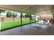 Covered patio overlooking a well-maintained backyard with artificial grass and privacy wall at 3010 E Yucca St, Phoenix, AZ 85028