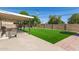 This home has a spacious backyard with a covered patio and artificial grass for low-maintenance enjoyment at 3010 E Yucca St, Phoenix, AZ 85028