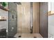 Modern bathroom with stylish tiled shower featuring rainfall showerhead and sleek fixtures at 3010 E Yucca St, Phoenix, AZ 85028