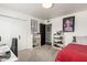 Spacious bedroom with a desk, a closet, and decorative shelving, blending style with functionality at 3010 E Yucca St, Phoenix, AZ 85028