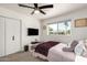 Inviting bedroom with ceiling fan, closet, and a bright window offers a relaxing retreat at 3010 E Yucca St, Phoenix, AZ 85028