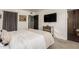 Well lit bedroom featuring neutral decor, a mirrored dresser, and a tv at 3010 E Yucca St, Phoenix, AZ 85028