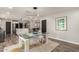 Bright dining room featuring a modern light fixture and seating for four at 3010 E Yucca St, Phoenix, AZ 85028