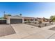 Charming single-story home exhibiting desert landscaping and a spacious driveway, perfect for suburban living at 3010 E Yucca St, Phoenix, AZ 85028