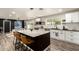 Open kitchen with island seating, stainless steel appliances, and modern design at 3010 E Yucca St, Phoenix, AZ 85028