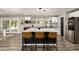 This kitchen features an island with seating and stainless steel appliances at 3010 E Yucca St, Phoenix, AZ 85028