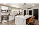 Kitchen featuring a large island with seating, stainless steel appliances, and white cabinetry at 3010 E Yucca St, Phoenix, AZ 85028