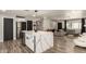 Open concept kitchen with an island including wine storage and stainless steel appliances at 3010 E Yucca St, Phoenix, AZ 85028