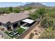 Backyard featuring modern outdoor living with artificial turf, lounge area, and a stylish shade structure at 33667 N 71St Way, Scottsdale, AZ 85266