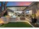 Relaxing backyard with a water feature, lush landscaping, and comfortable seating areas at 33667 N 71St Way, Scottsdale, AZ 85266