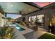 Entertainer's backyard with a sparkling water feature and seamless indoor-outdoor living at 33667 N 71St Way, Scottsdale, AZ 85266