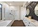 Modern bathroom with glass shower, freestanding tub, and dual sink vanity at 33667 N 71St Way, Scottsdale, AZ 85266