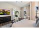 Well-lit primary bedroom with a private patio entrance and neutral colors at 33667 N 71St Way, Scottsdale, AZ 85266