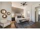 Bright bedroom featuring neutral tones, pendant lights and a stylish accent wall at 33667 N 71St Way, Scottsdale, AZ 85266