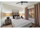 Comfortable bedroom featuring soft lighting, neutral tones and modern art at 33667 N 71St Way, Scottsdale, AZ 85266