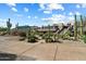 Stunning home with desert landscaping featuring native plants and an eye-catching architectural design at daytime at 33667 N 71St Way, Scottsdale, AZ 85266