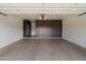 Spacious garage featuring epoxy floors and custom built-in storage cabinets at 33667 N 71St Way, Scottsdale, AZ 85266
