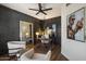 Contemporary home office with decorative wall and light-filled seating area at 33667 N 71St Way, Scottsdale, AZ 85266