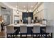 Modern kitchen with a large island, stylish pendant lighting, and sleek countertops at 33667 N 71St Way, Scottsdale, AZ 85266